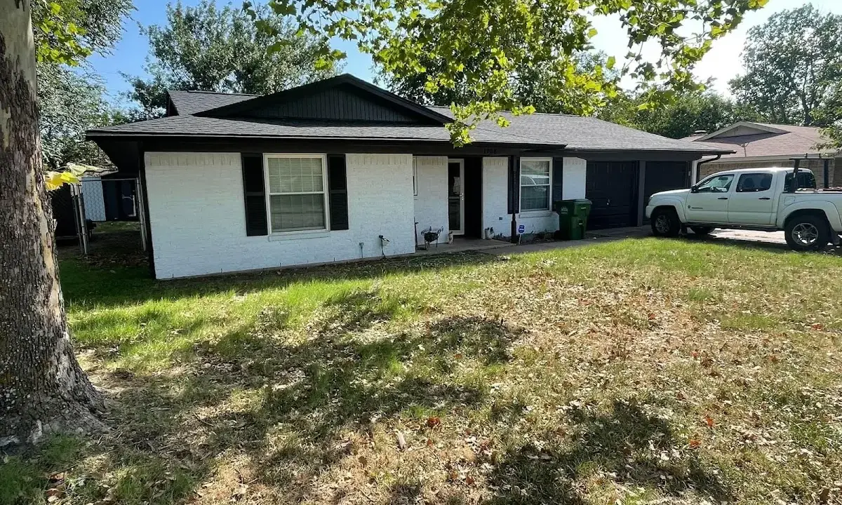 Professional roofing crew working on a residential roof in Arnold